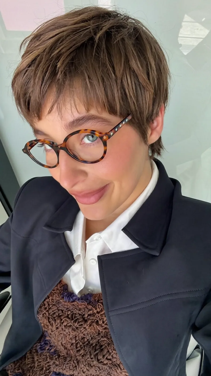 Modern Textured Pixie Cut with Wispy Bangs for Ovals
