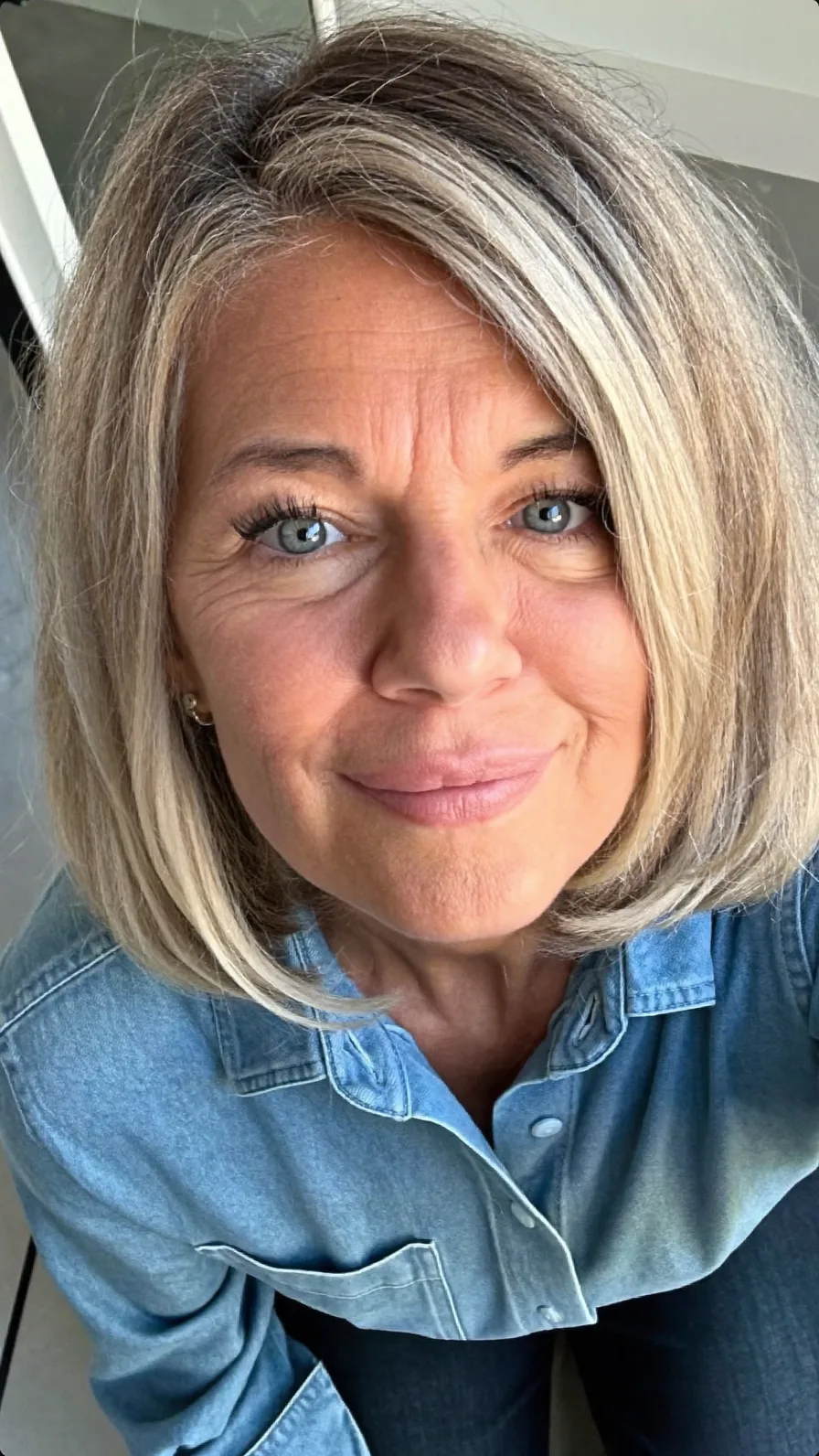 Sleek Chin-Length Ash Blonde Bob with Side-Swept Bangs
