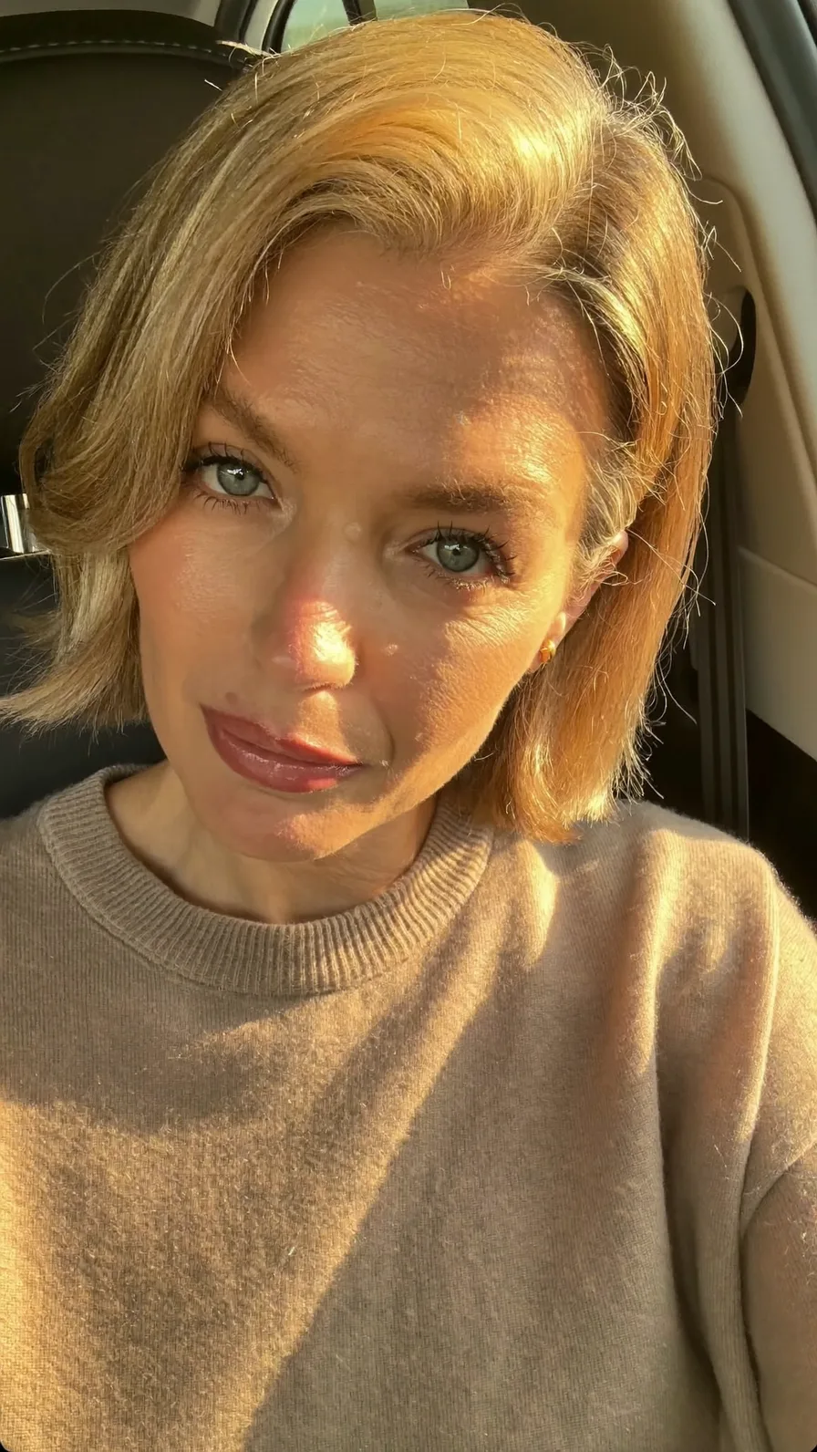 Classic Golden Blonde Chin-Length Bob with Soft Side-Swept Layers