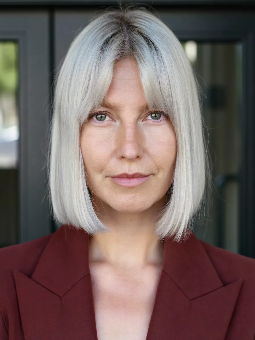 Sleek Shoulder-Length Platinum Blonde Blunt Bob with Curtain Bangs