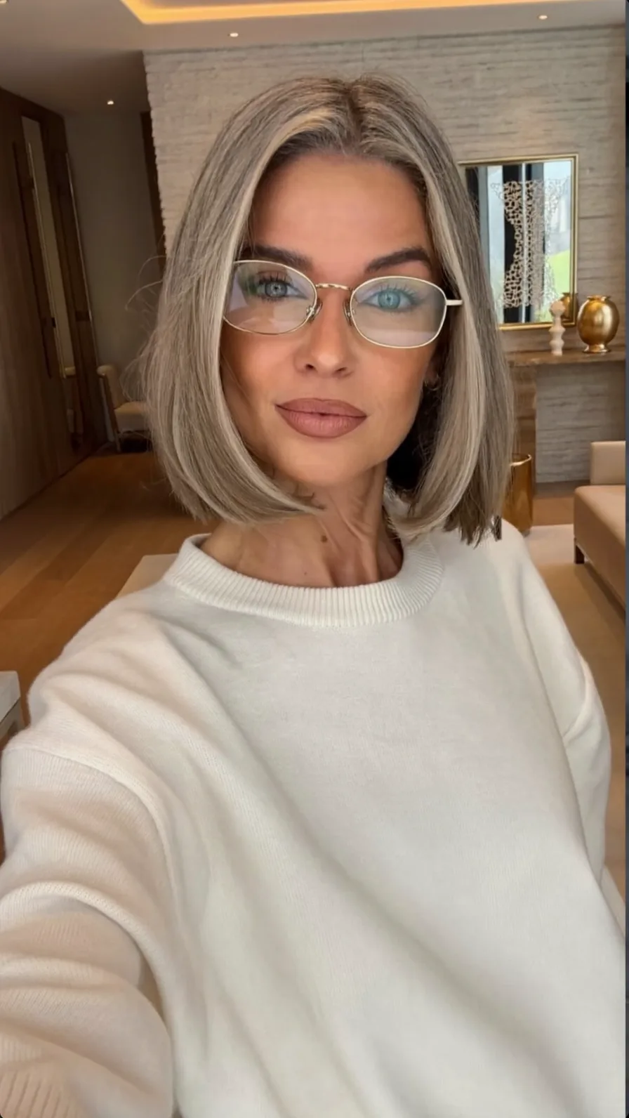 Chic Ash Blonde Rounded Bob with Center Part and Highlights