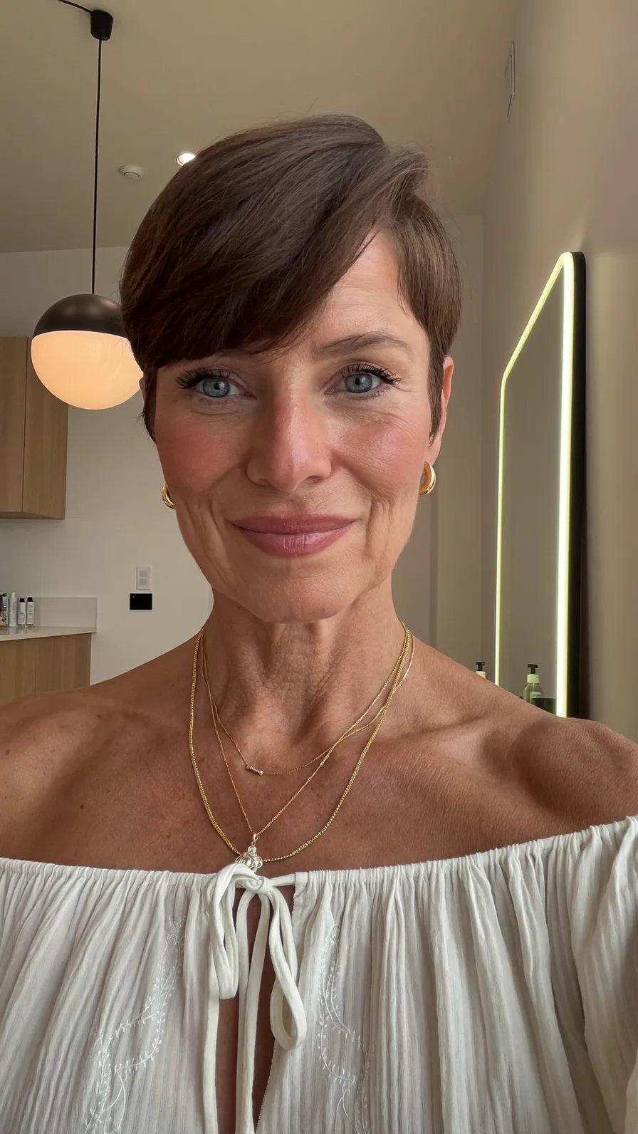 Sleek Short Ash Brown Pixie with Side-Swept Bangs