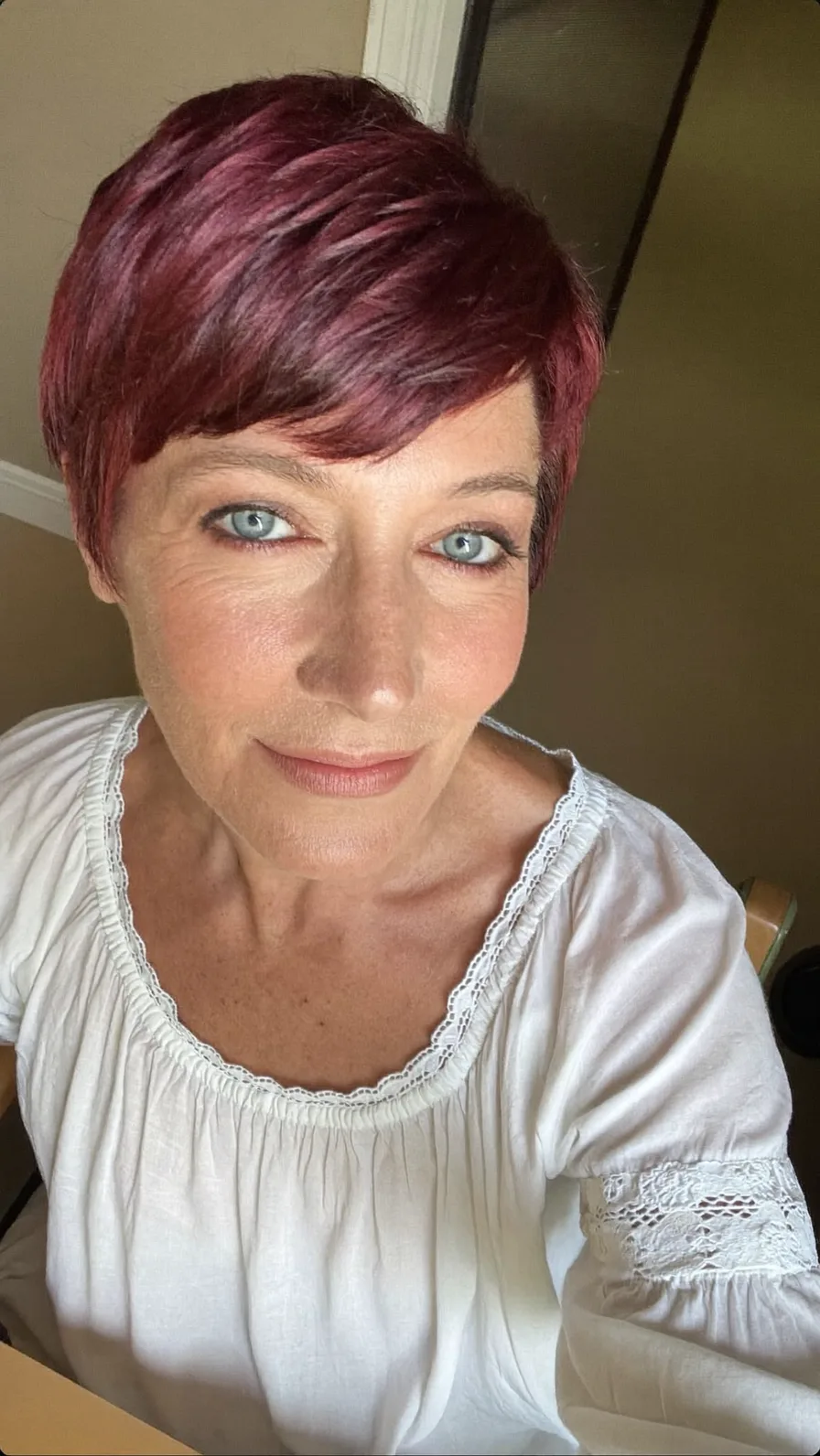 Chic Textured Burgundy Pixie Cut with Side-Swept Bangs
