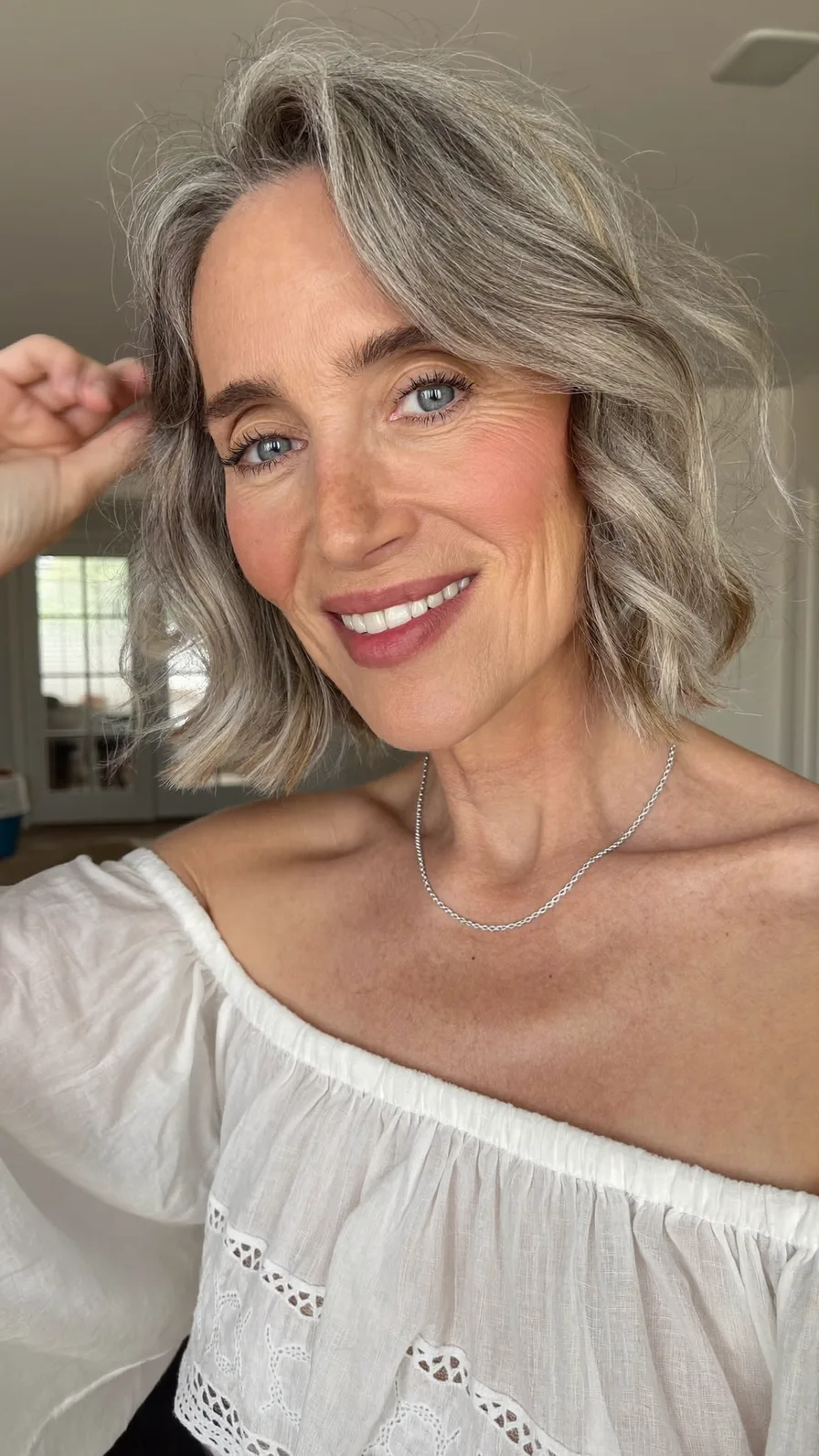 Elegant Soft Layered Chin-Length Silver Bob with Curtain Bangs