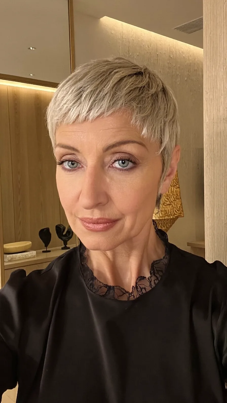 Textured Platinum Blonde Pixie with Choppy Short Bangs