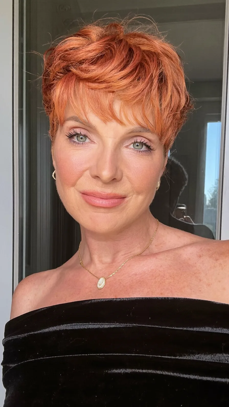 Voluminous Textured Pixie Cut with Wispy Copper Bangs