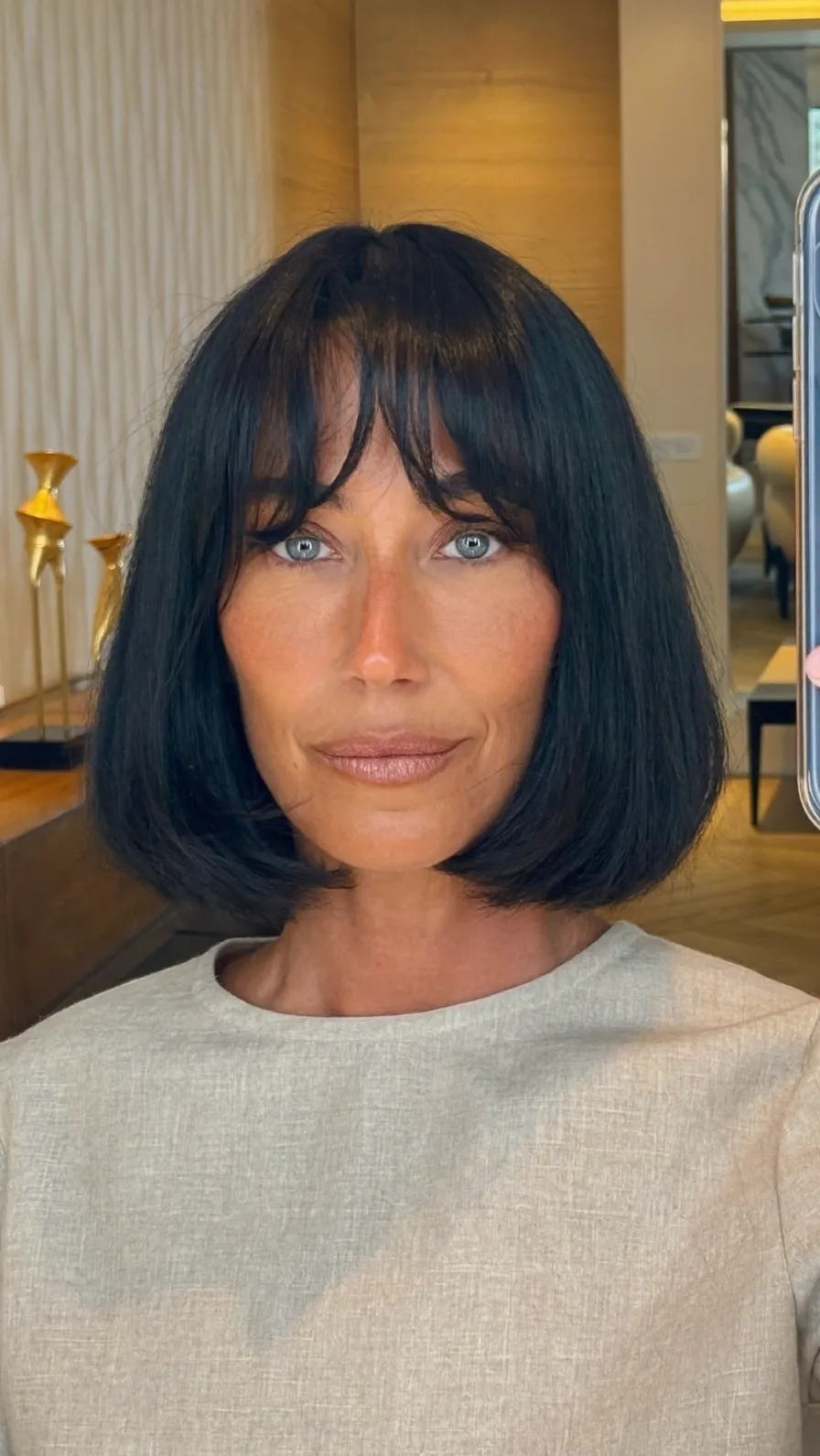 Sleek Chin-Length Jet Black Bob with Curtain Bangs