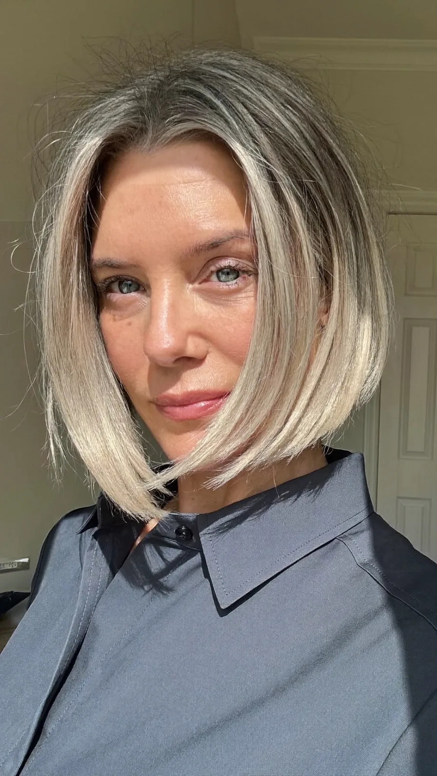Sleek Rounded Chin-Length Ash Blonde Blunt Bob Hairstyle
