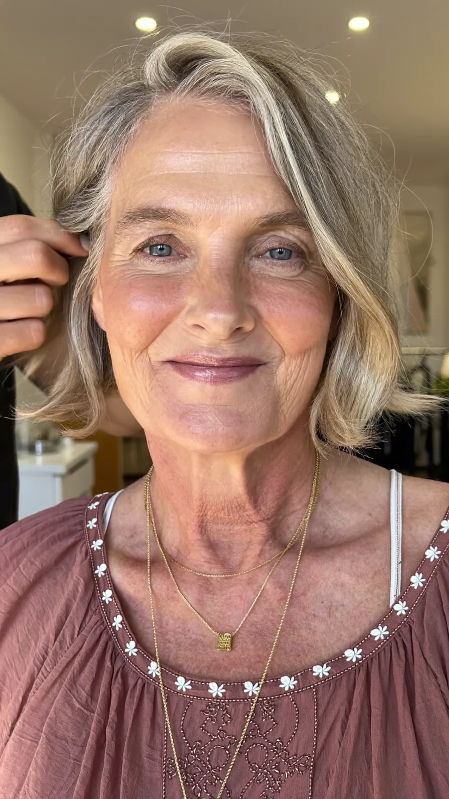 Elegant Chin-Length Ash Blonde Wavy Bob with Side-Swept Bangs