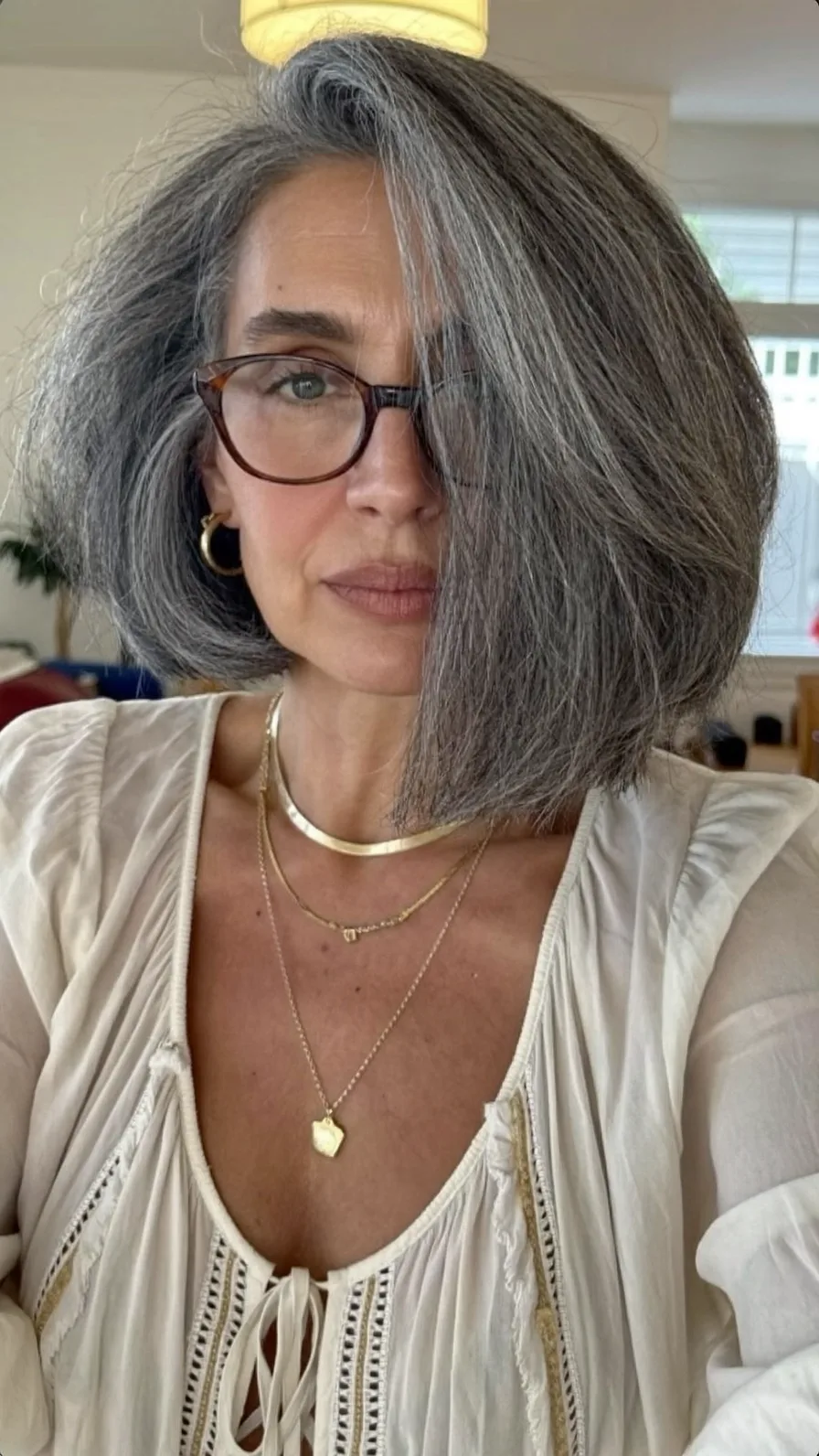 Voluminous Salt and Pepper Wavy Chin-Length Bob with Side Sweep
