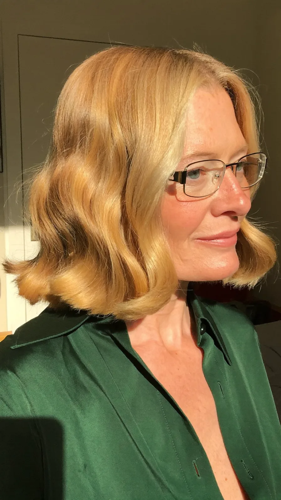 Elegant Warm Golden Blonde Chin-Length Flicked Bob