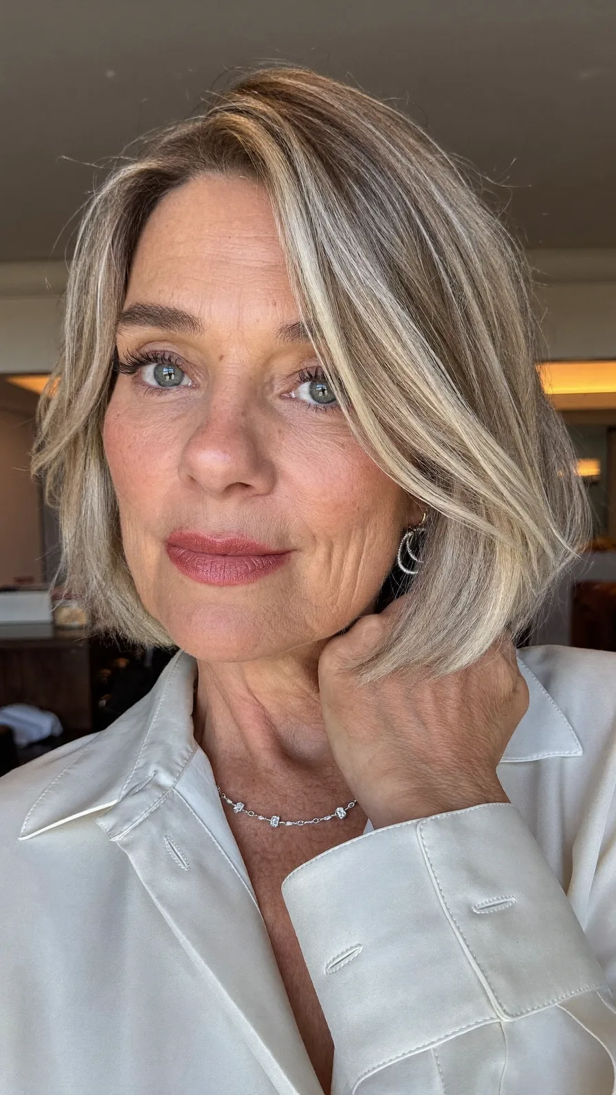 Chin-Length Ash Blonde Bob with Subtle Side-Swept Bangs