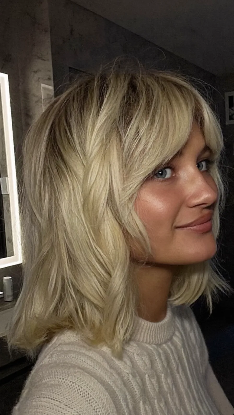 Modern Ash Blonde Layered Hairstyle with Curtain Bangs