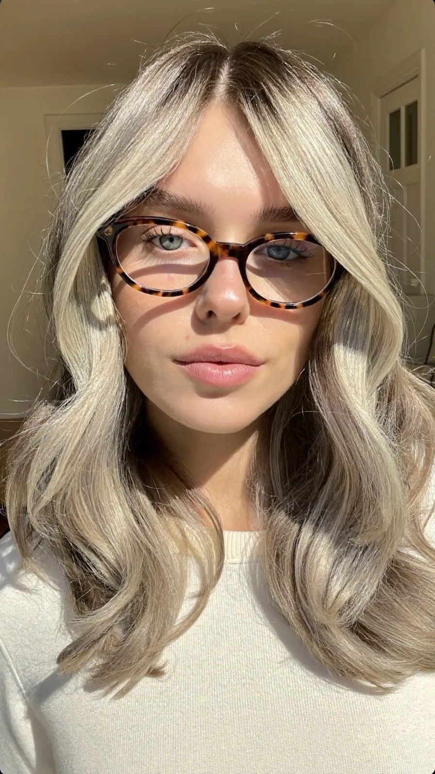 Modern Shoulder-Length Ash Blonde Hair with Flowing Curtain Bangs