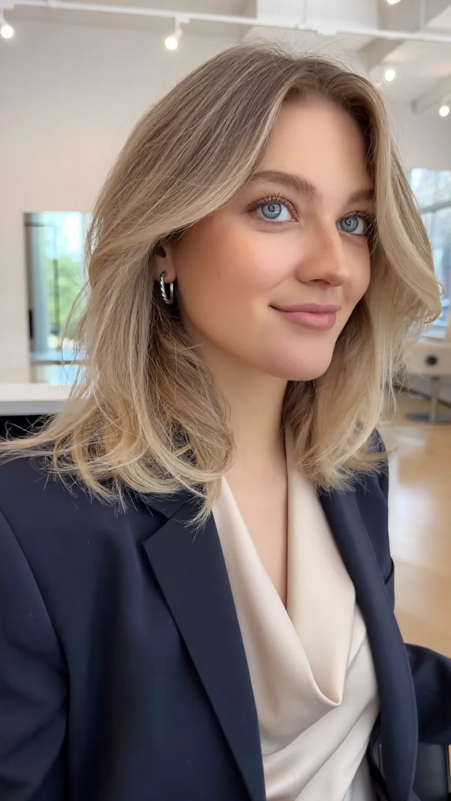 Sophisticated Shoulder-Length Ash Blonde Long Layers Hairstyle