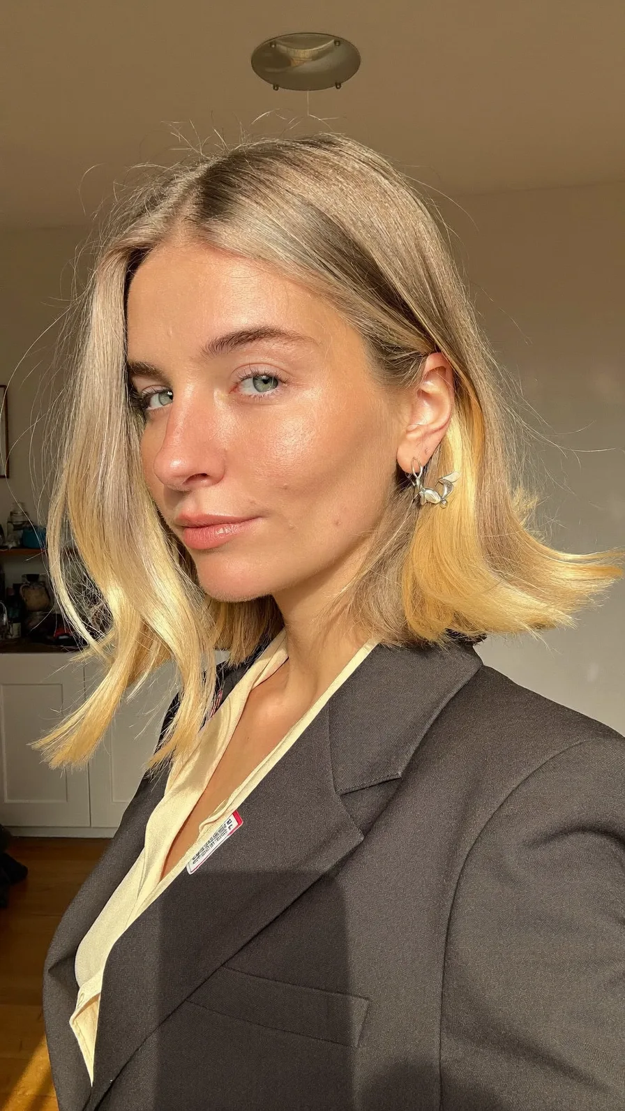 Sleek Ash Blonde Blunt Bob with Flicked Ends