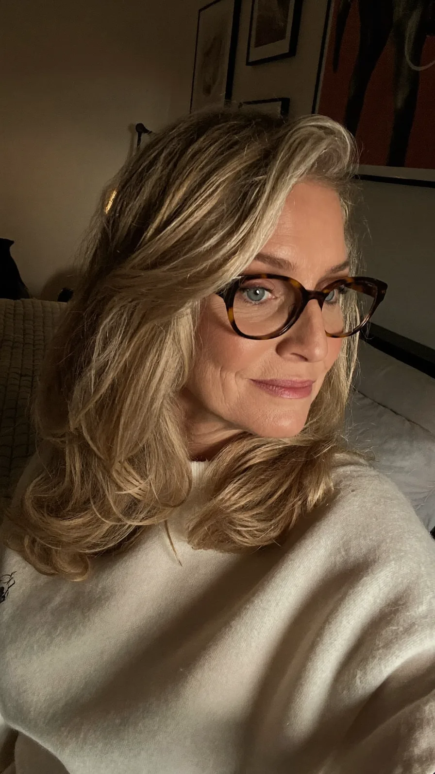 Voluminous Shoulder-Length Layered Ash Blonde Hairstyle