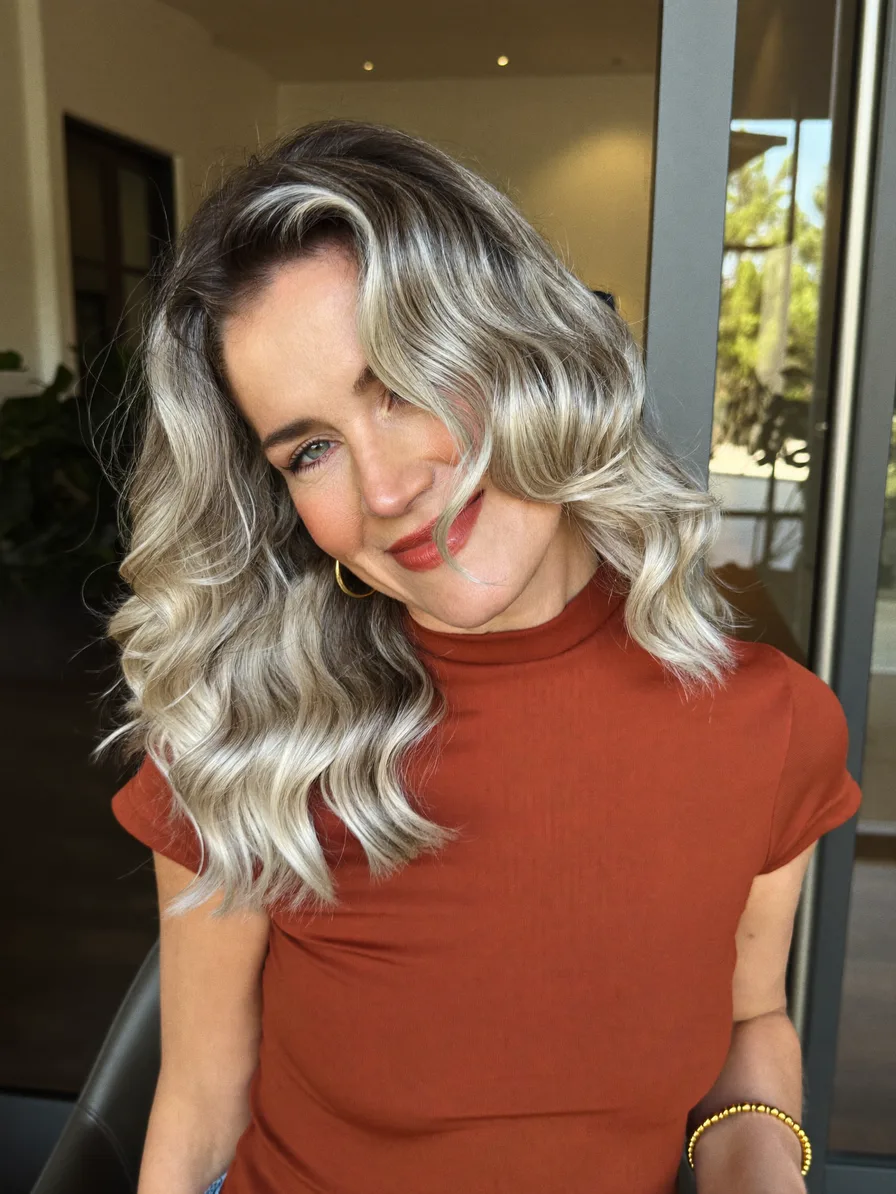 Elegant Shoulder-Length Soft Waves with Side-Swept Highlights
