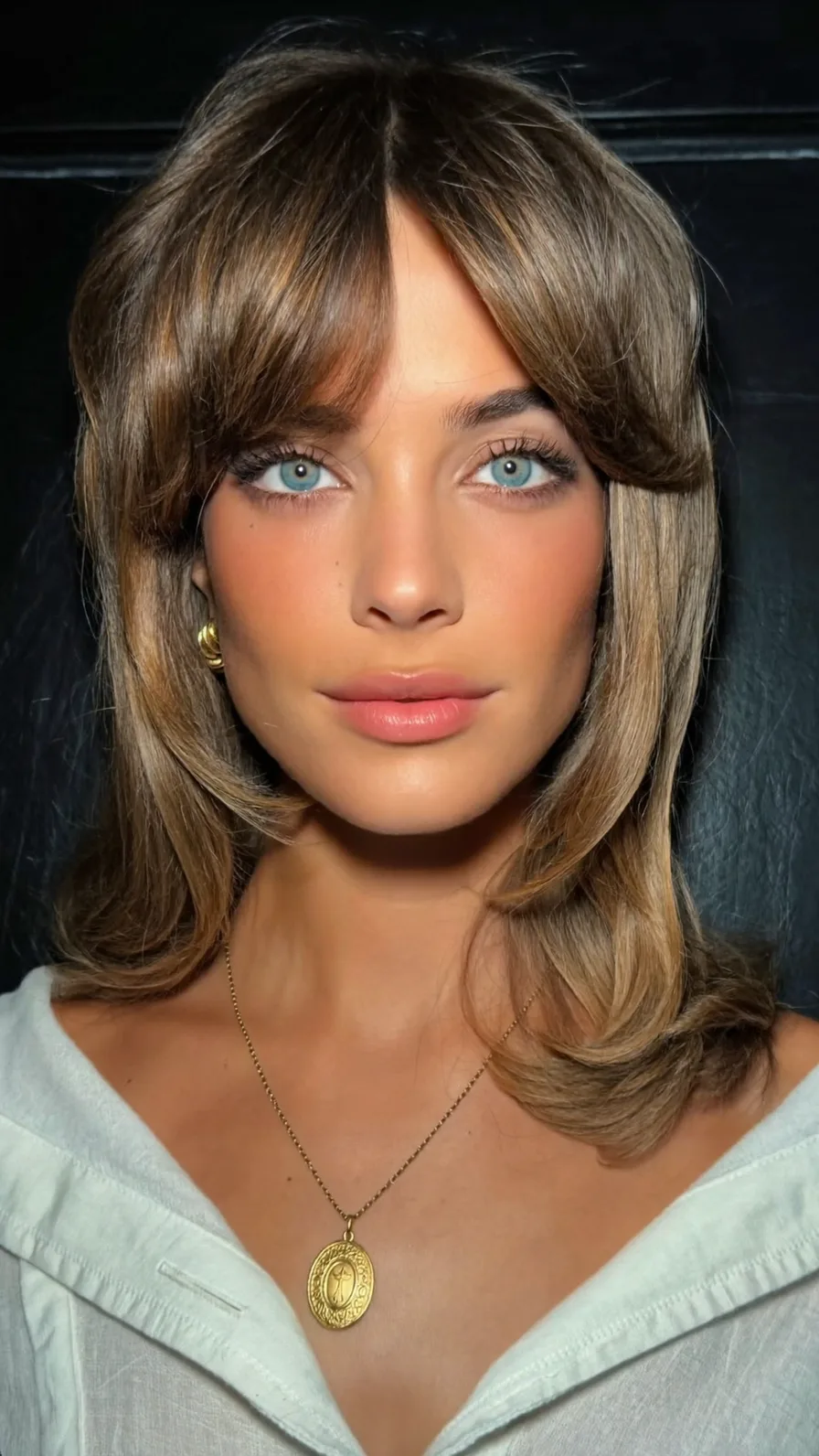 Soft Feathered Shoulder-Length Cut with Curtain Bangs