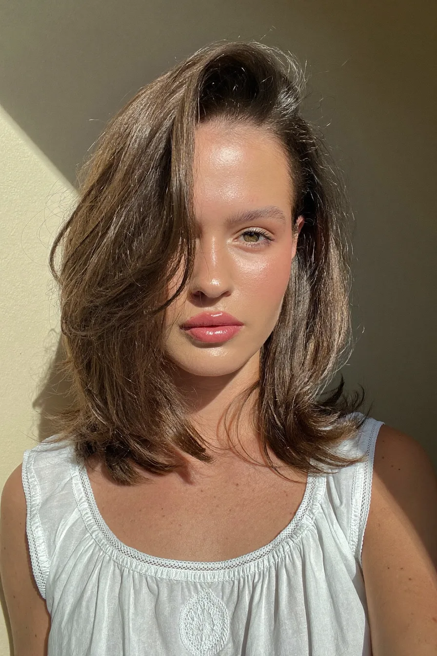 Soft Shoulder-Length Long-Layered Hairstyle with Side-Swept Bangs