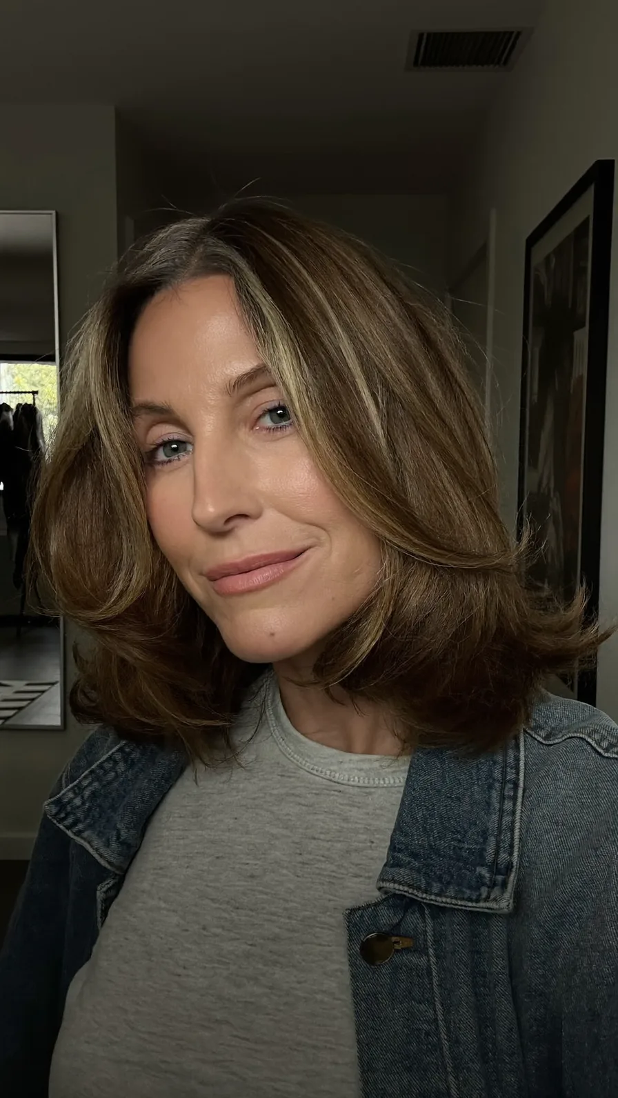 Soft Feathered Shoulder-Length Waves with Curtain Bangs