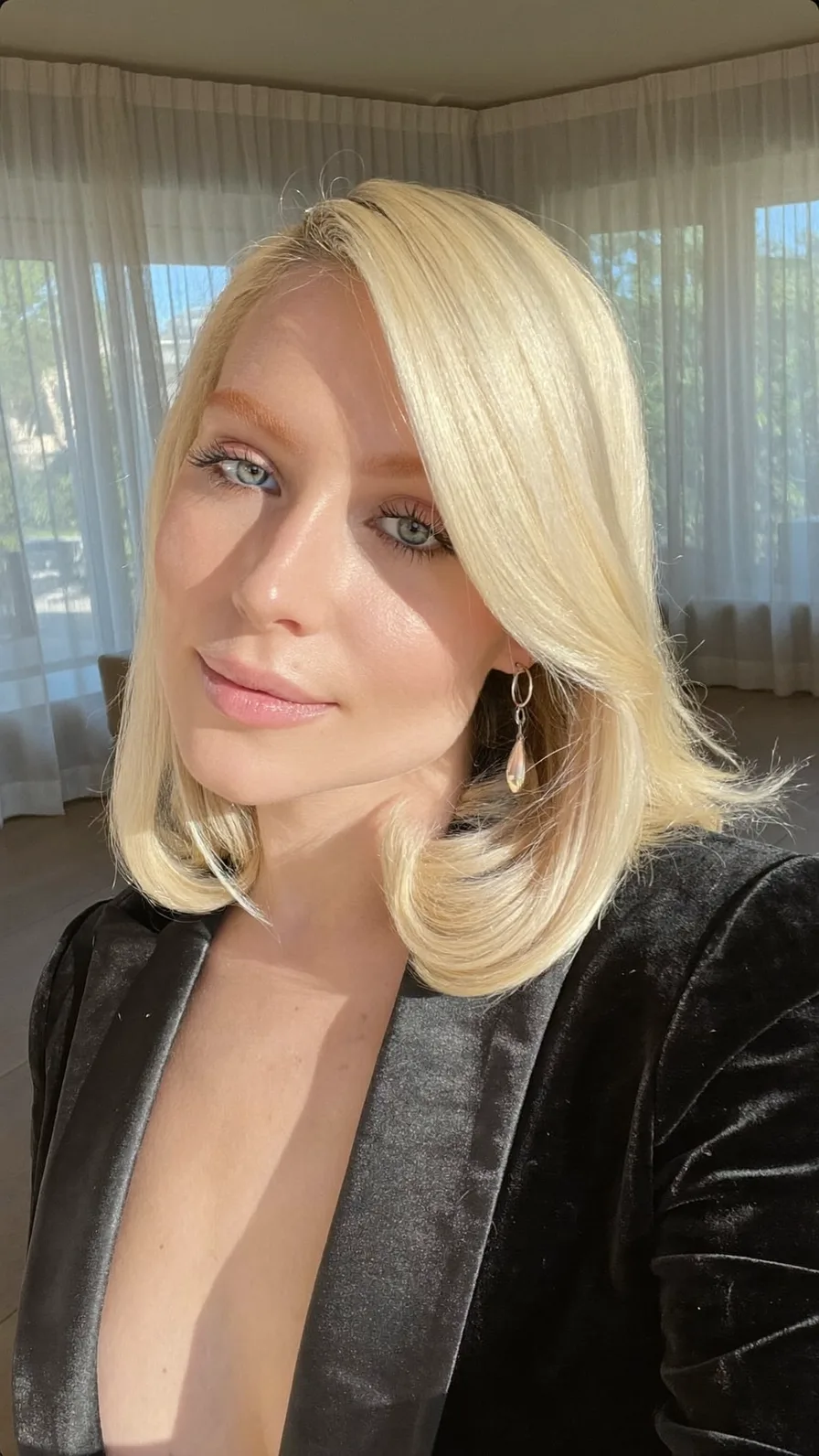 Sleek Platinum Blonde Shoulder-Length Flicked Bob Style