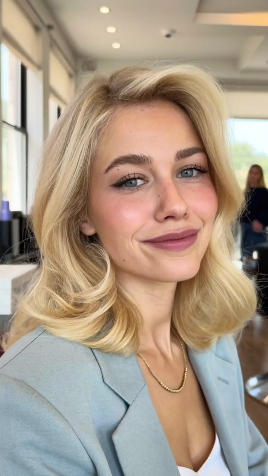 Voluminous Shoulder-Length Golden Blonde Long Bob Waves