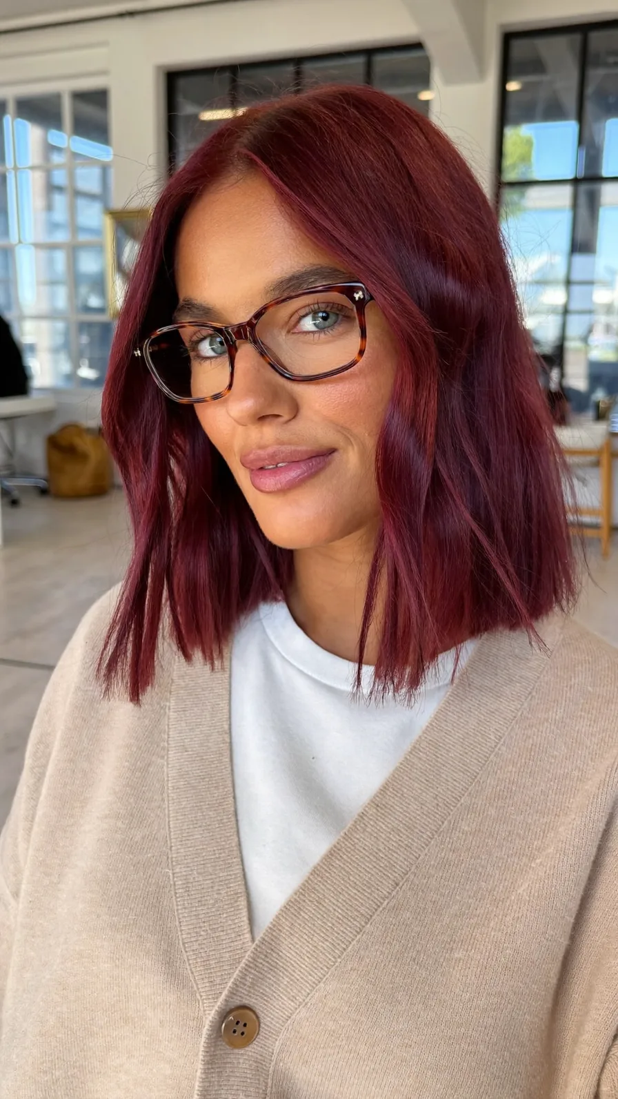 Sleek Shoulder-Length Blunt Bob with Vibrant Burgundy Hue