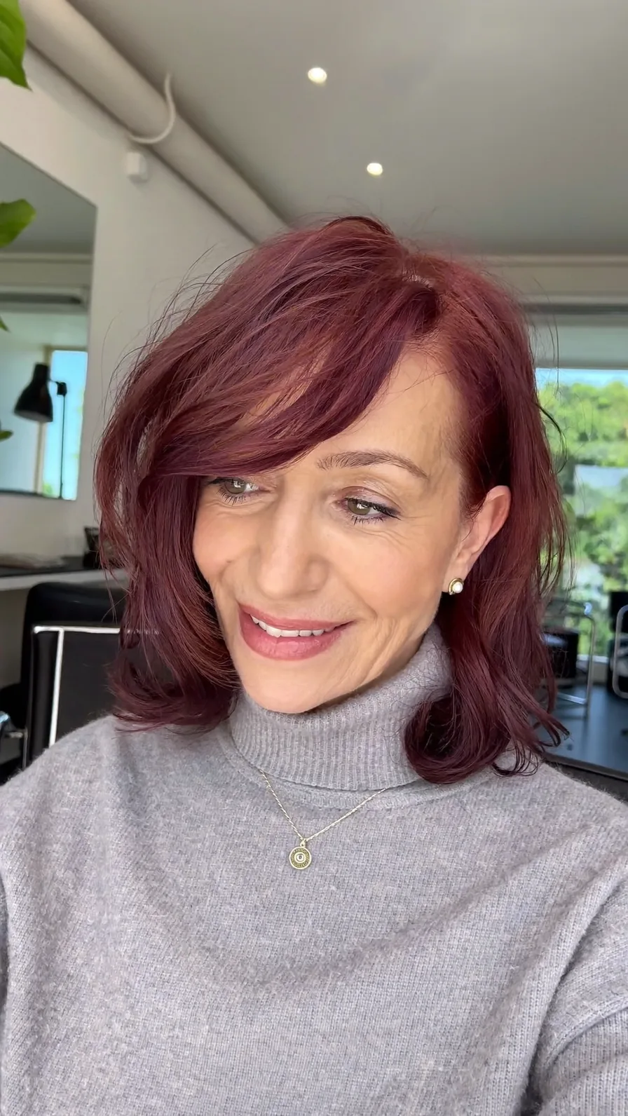 Modern Textured Shoulder-Length Layered Burgundy Hairstyle