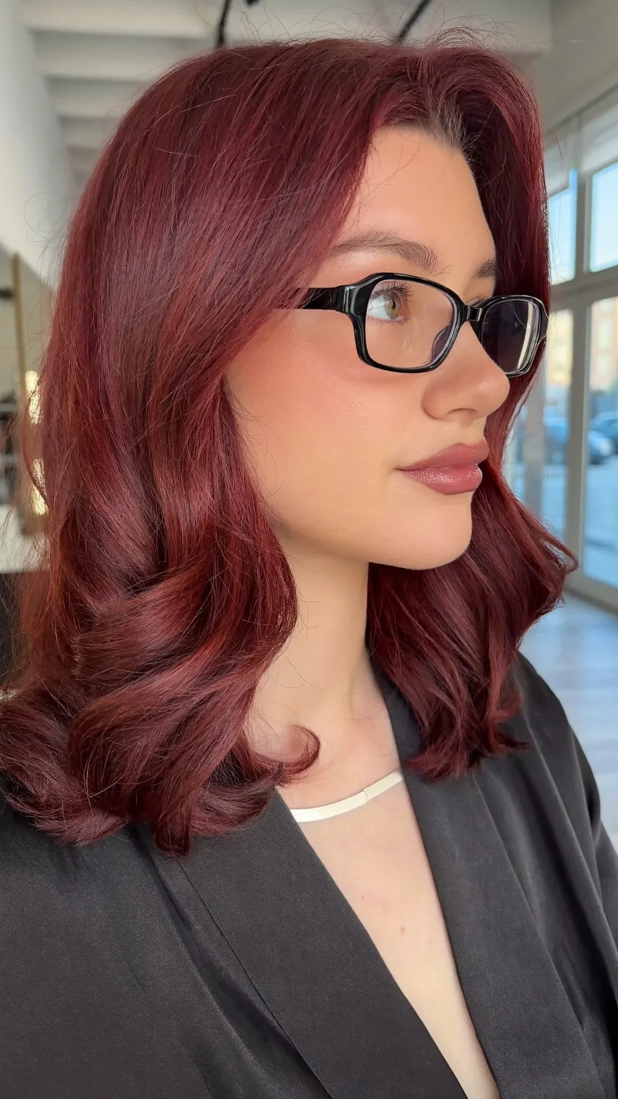 Sophisticated Shoulder-Length Burgundy Hair with Flowing Long Layers