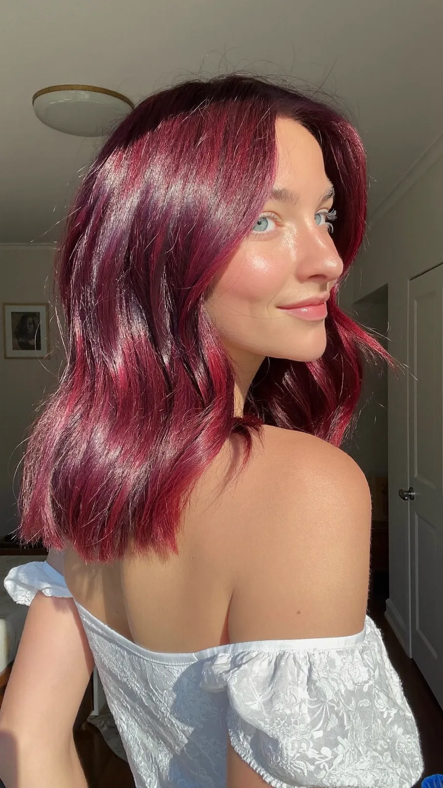 Vibrant Burgundy Shoulder-Length Hairstyle with Curtain Bangs