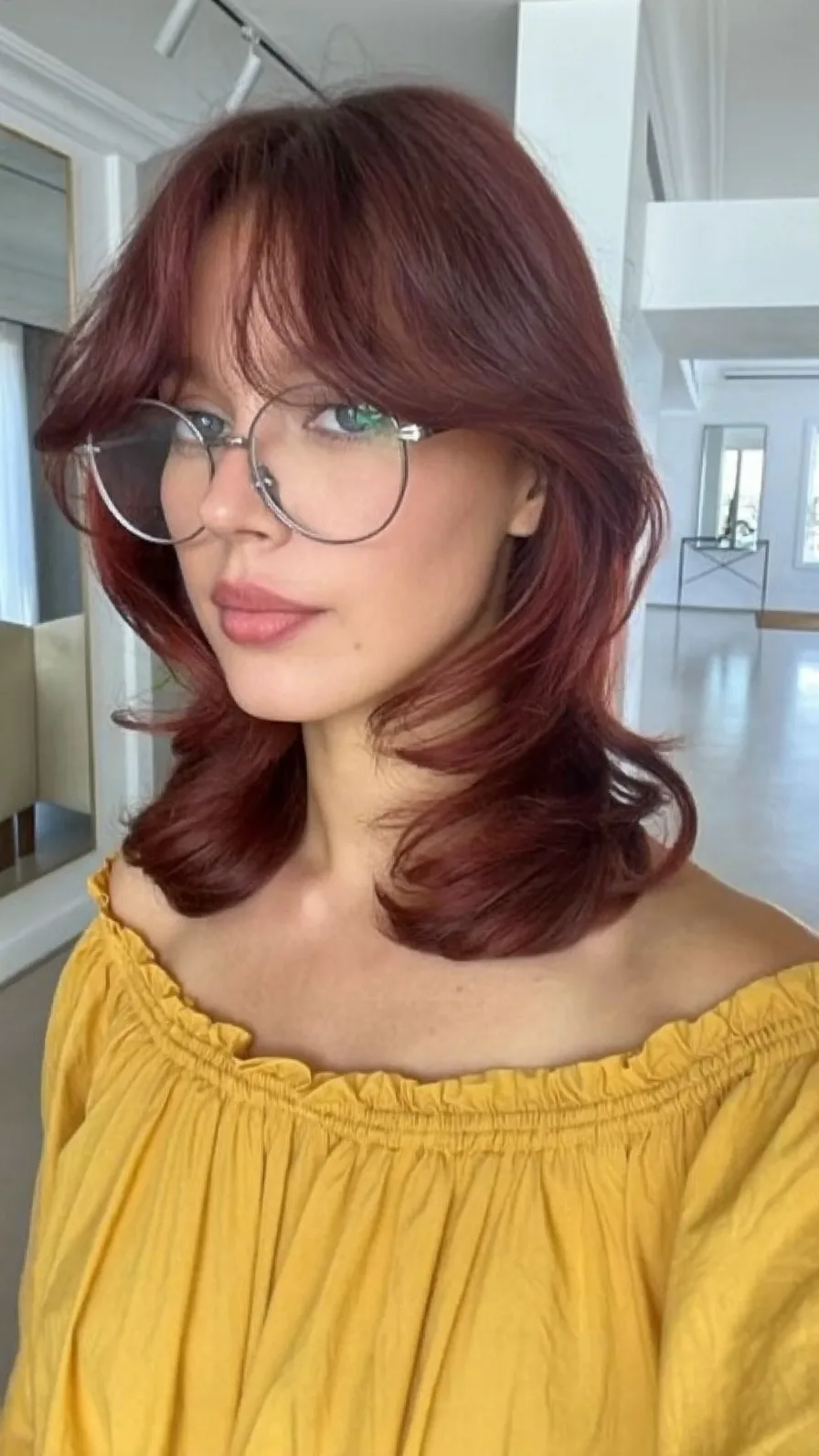 Modern Feathered Shoulder-Length Cut with Curtain Bangs