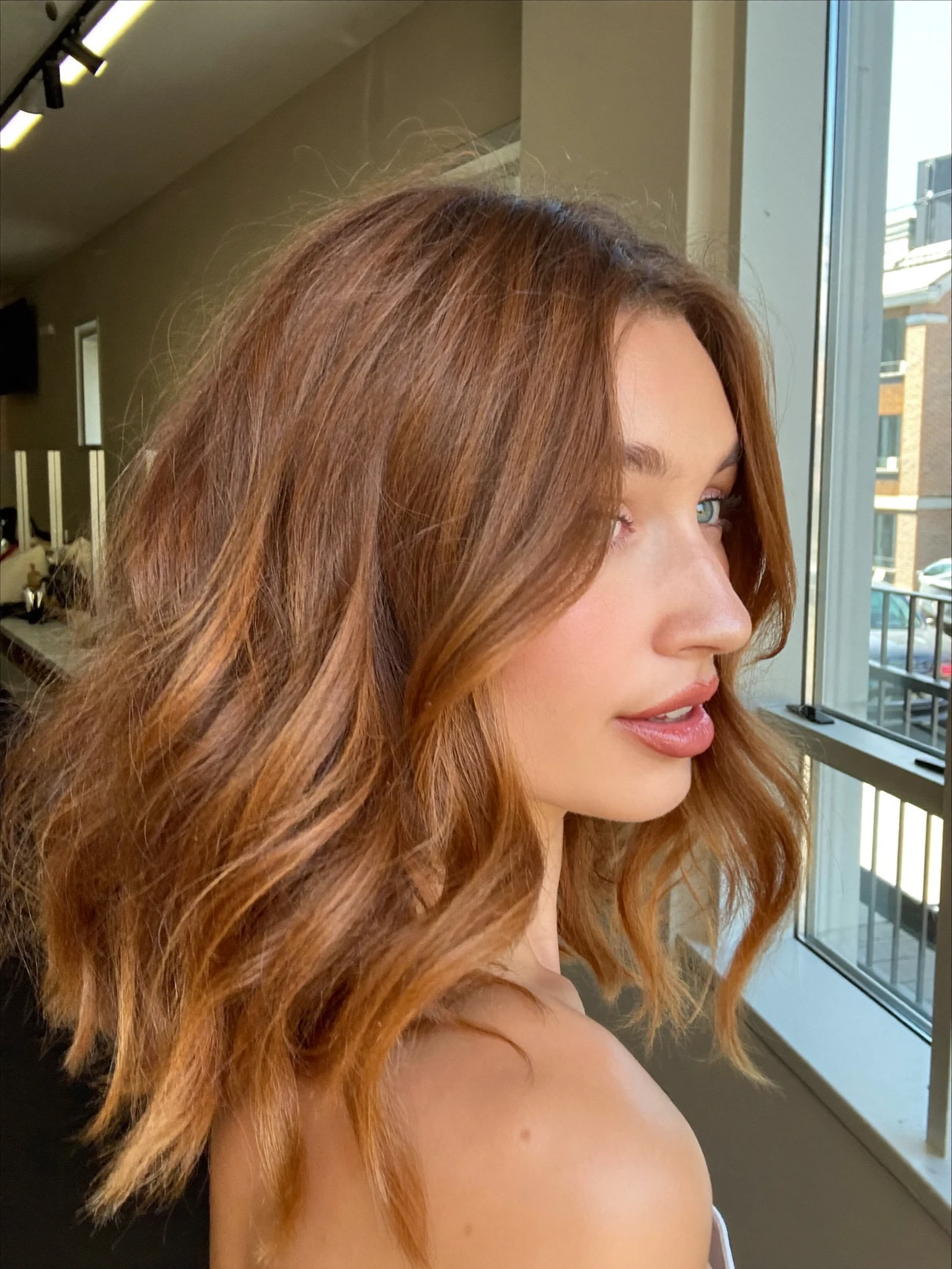 Warm All-Over Caramel Lob with Soft Tousled Styling