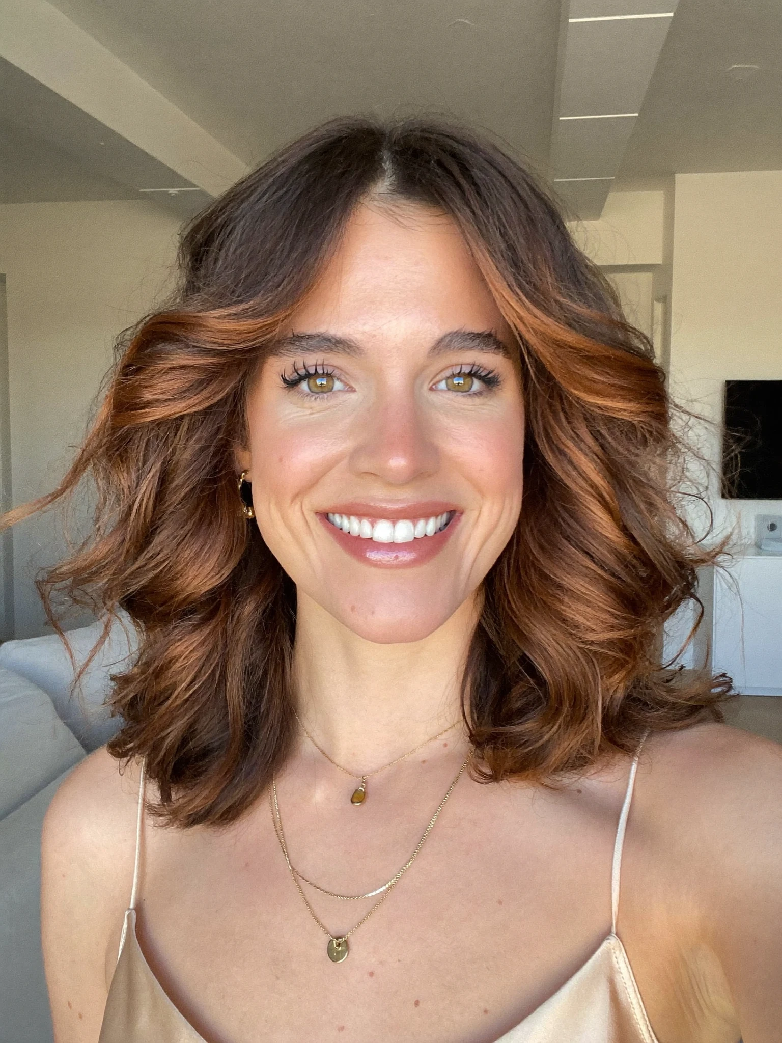 Middle-Part Lob with Tucked Face-Framing Highlights