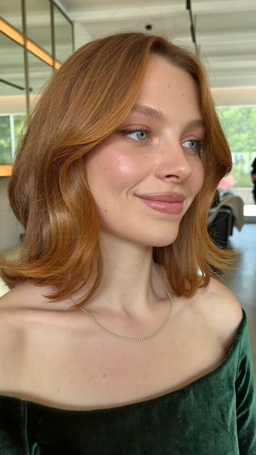 Soft Shoulder-Length Copper Lob with Curtain Bangs