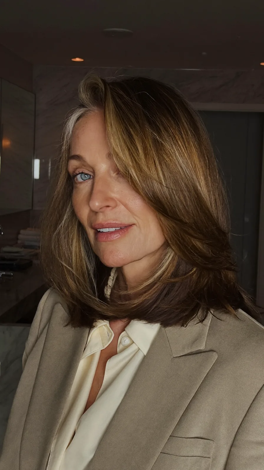 Sophisticated Shoulder-Length Hairstyle with Feathered Long Layers