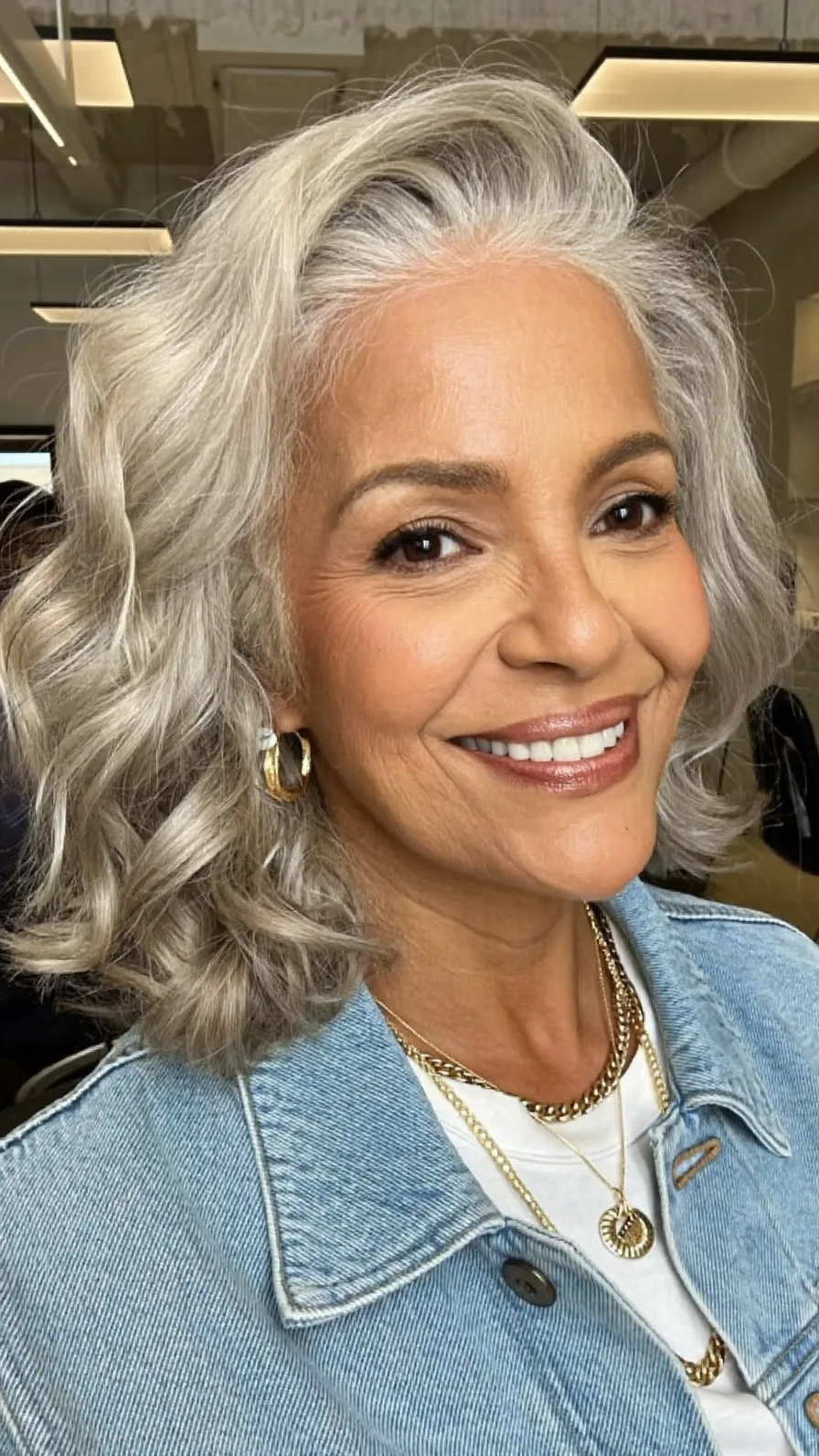 Voluminous Silver Gray Shoulder-Length Layered Waves Hairstyle