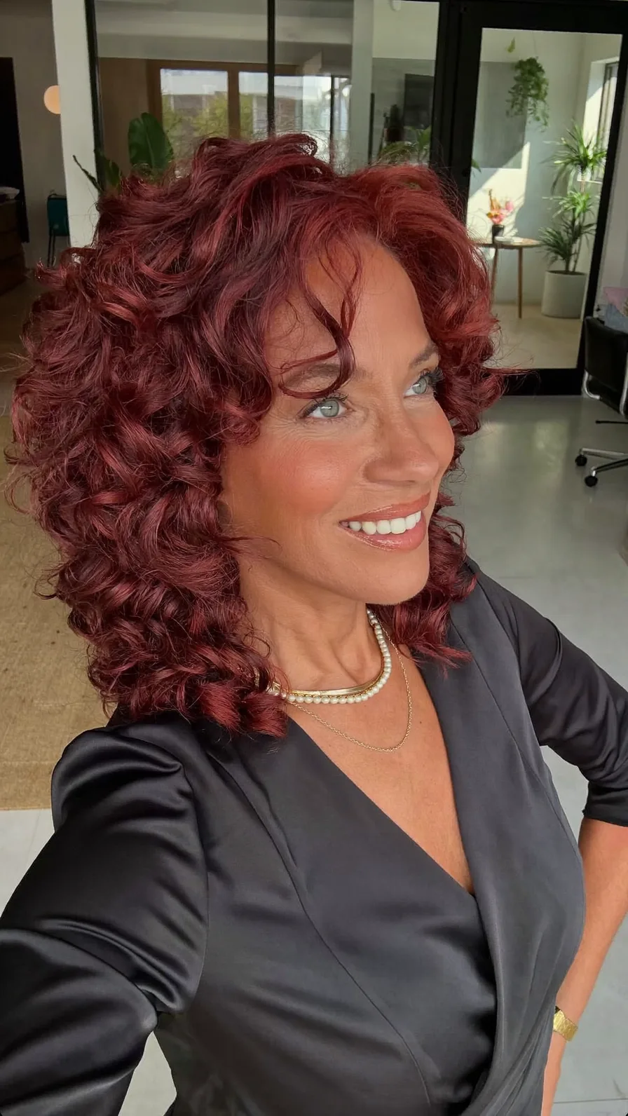 Voluminous Curly Burgundy Shoulder-Length Layered Hair