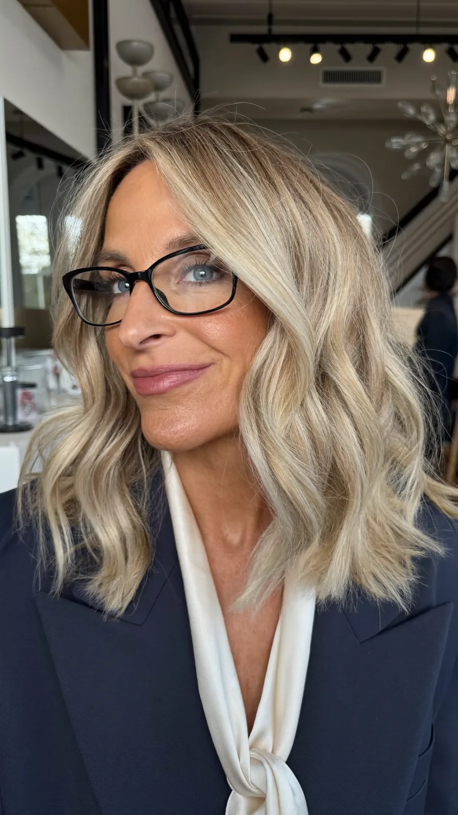 Sophisticated Shoulder-Length Blonde Waves with Curtain Bangs