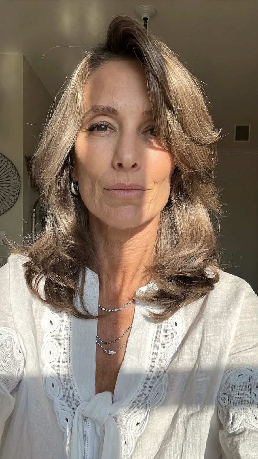 Elegant Shoulder-Length Ash Brown Layered Blowout Hairstyle