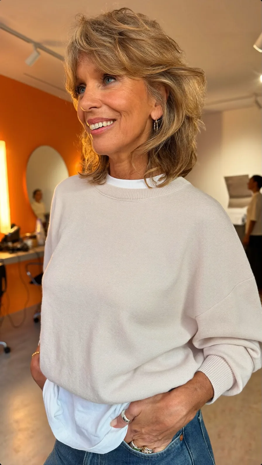 Textured Honey Blonde Feathered Shoulder-Length Hairstyle