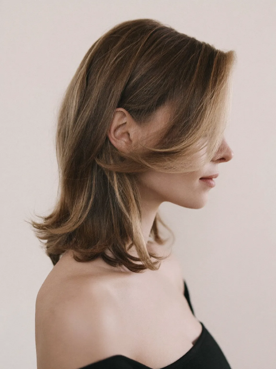 Layered Shoulder-Length Cut with Flicked Sandy Blonde Ends
