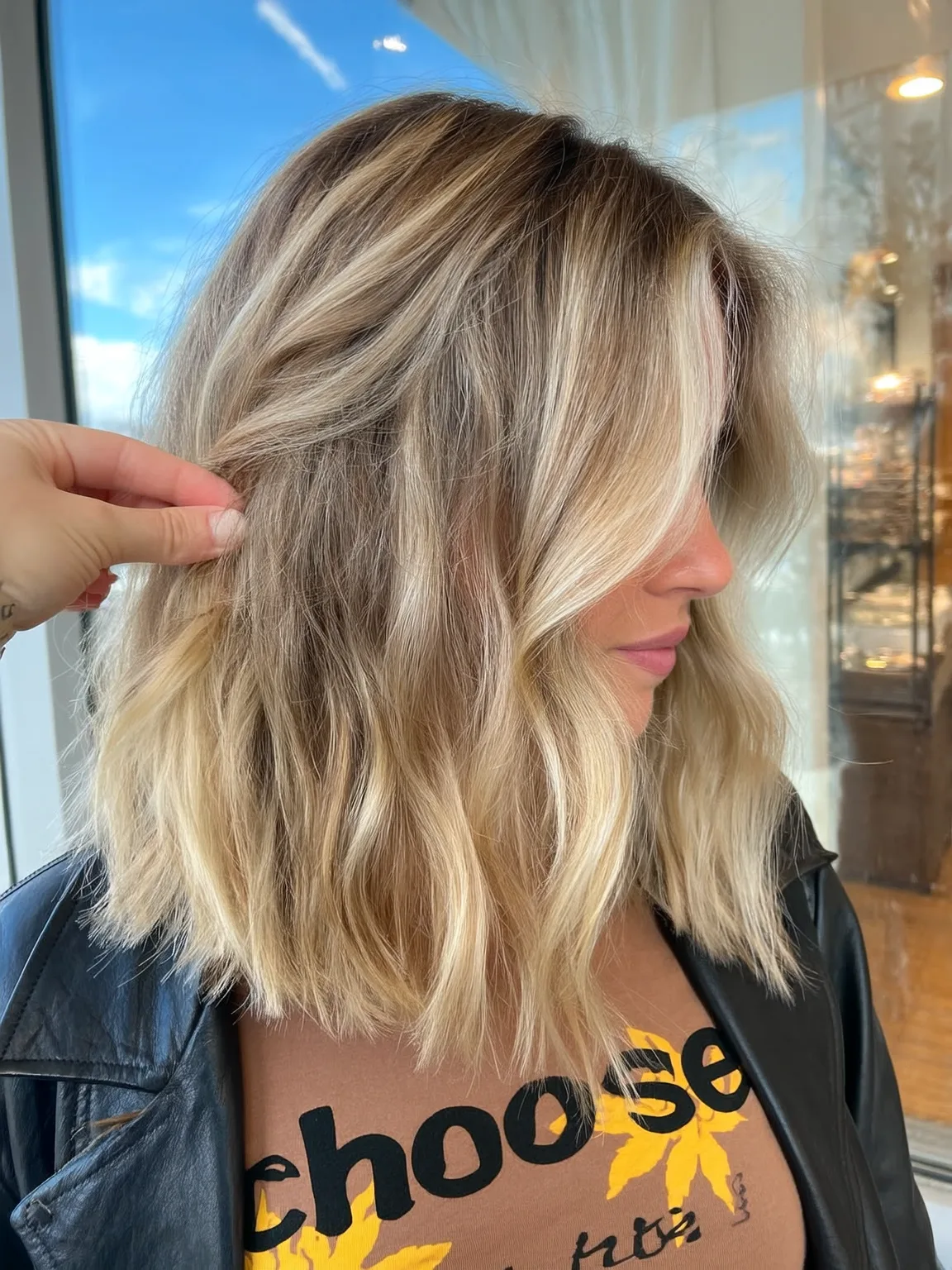 Flowing Sandy Blonde Lob with Balayage Highlights
