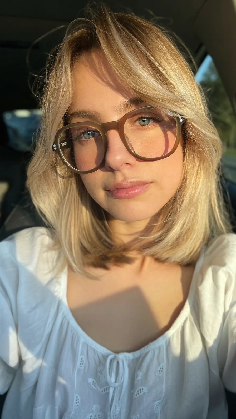 Shoulder-Length Honey Blonde Hair with Flowing Curtain Bangs