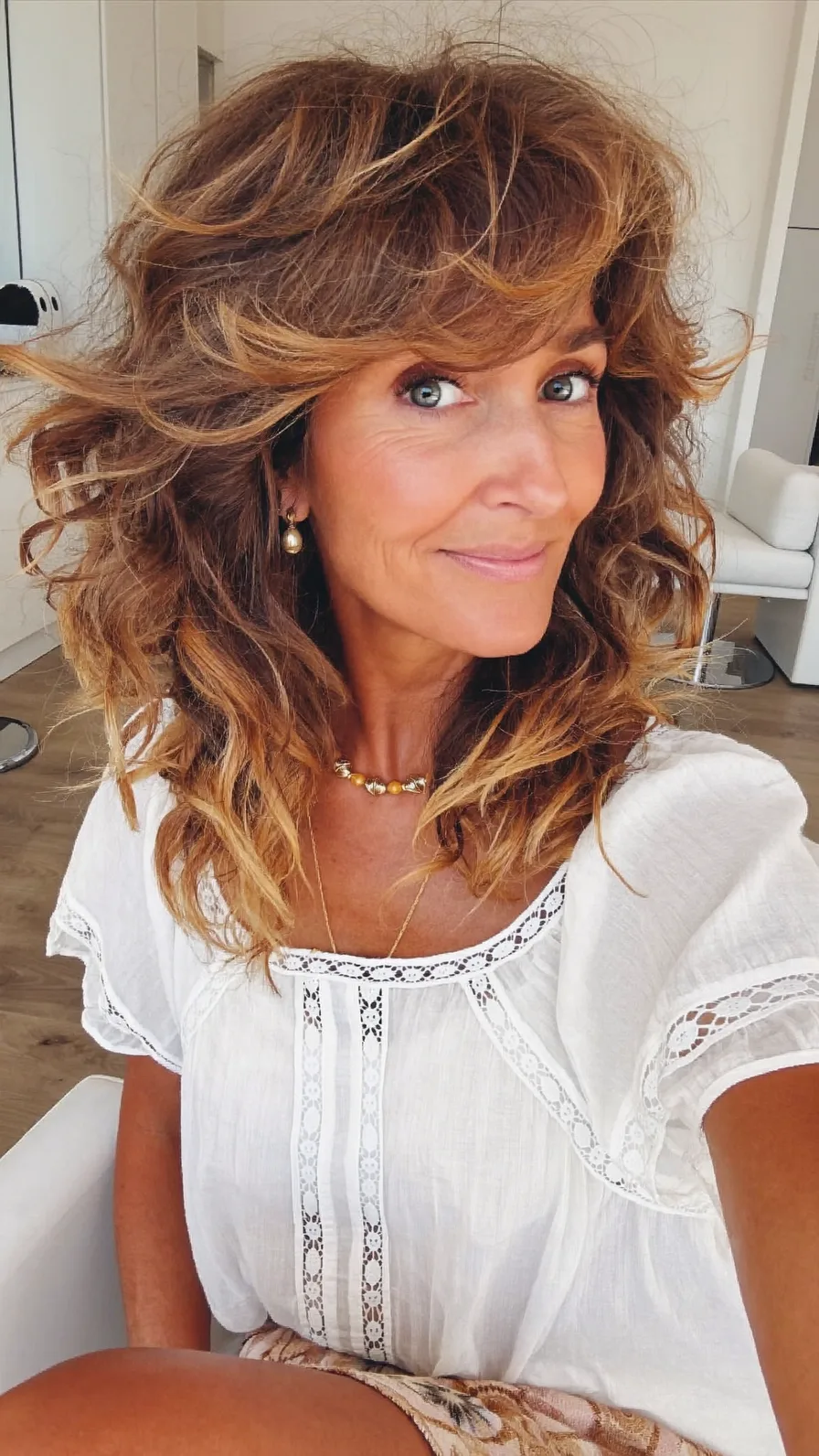 Voluminous Shoulder-Length Layered Hair with Curtain Bangs