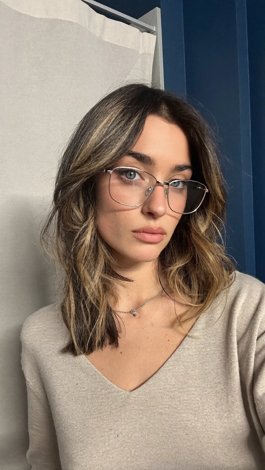 Modern Shoulder-Length Wavy Layers with Honey Blonde Balayage Highlights