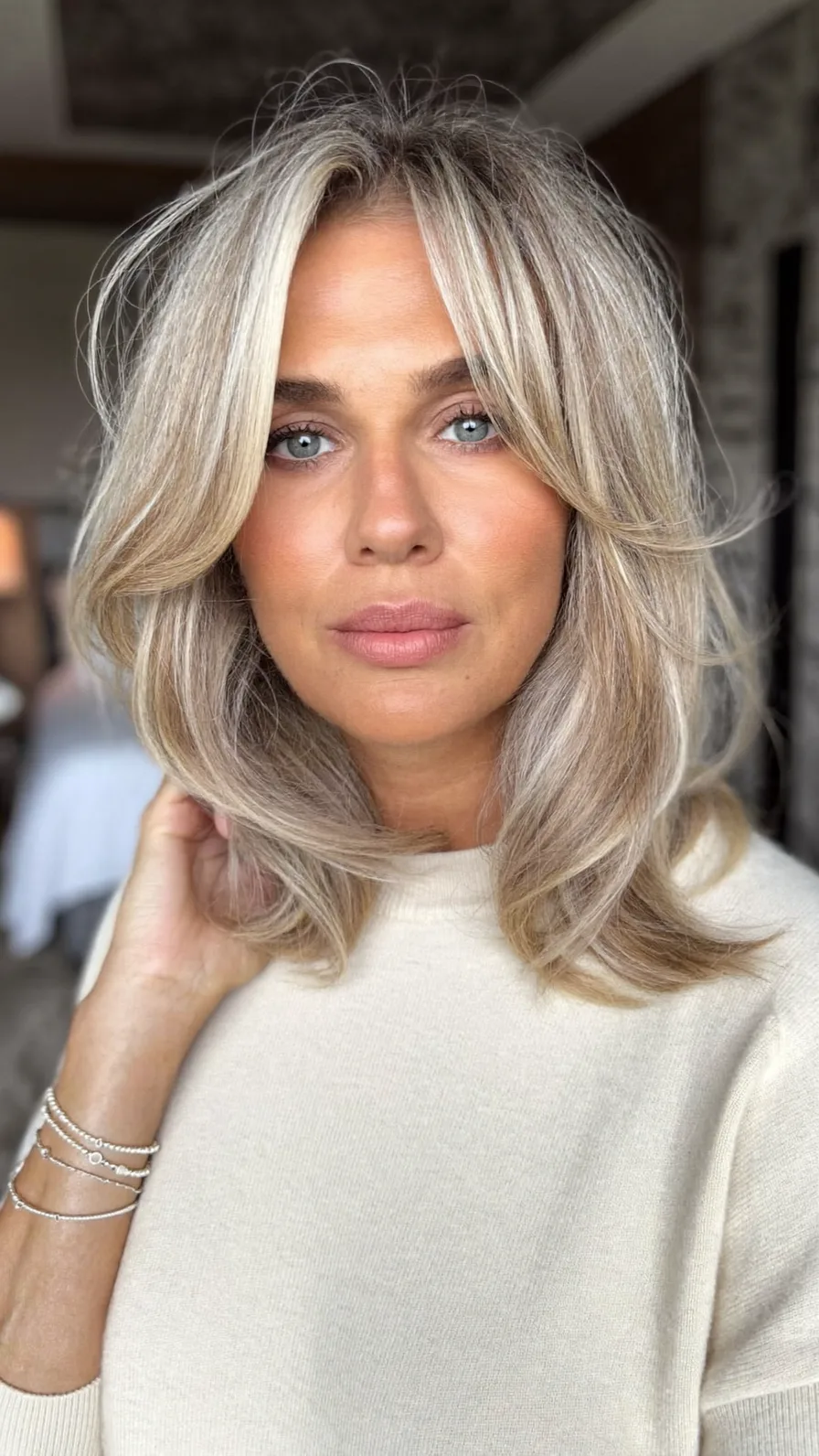 Elegant Shoulder-Length Ash Blonde Long Layered Blowout