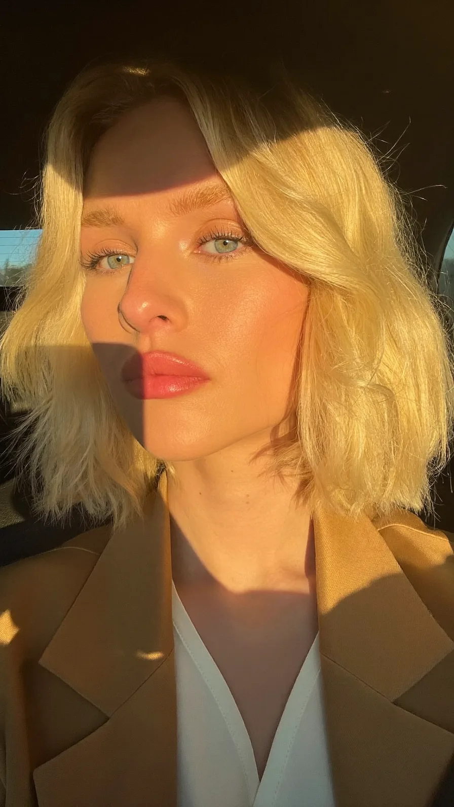 Modern Shoulder-Length Platinum Blonde Lob with Side-Swept Bangs
