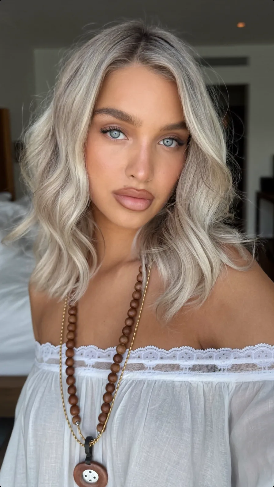 Modern Platinum Blonde Shoulder-Length Wavy Long Layers