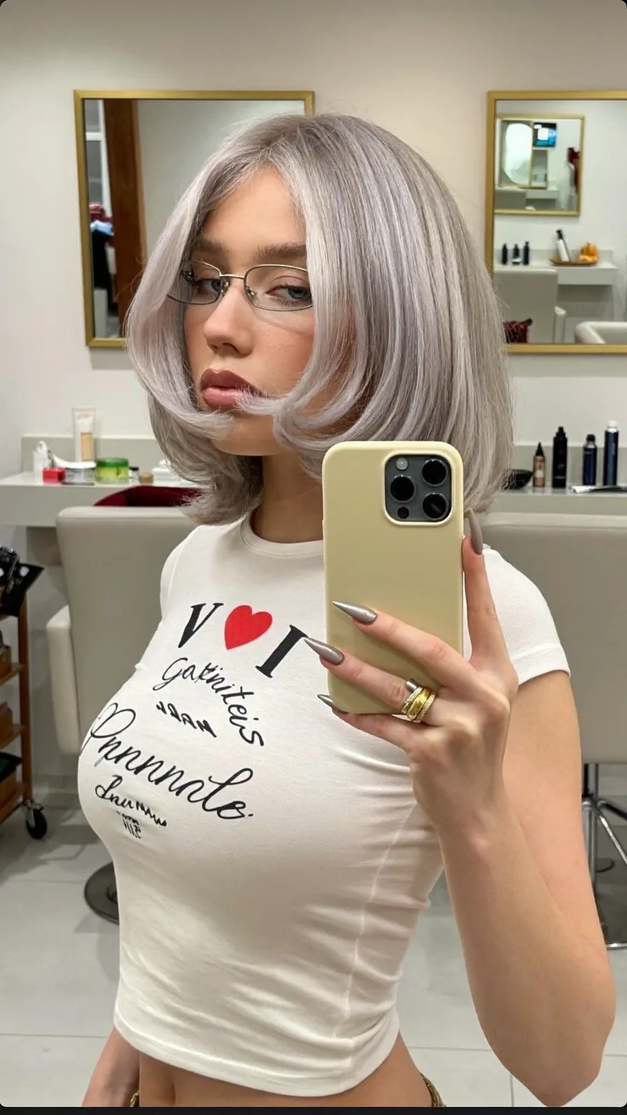 Sleek Platinum Blonde Blunt Bob with Center-Parted Long Bangs